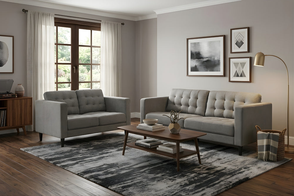 Conjunto de sofá y loveseat grises sobre fondo blanco.