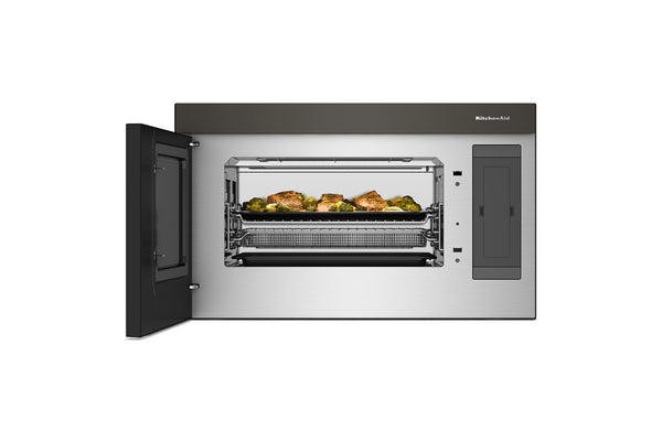 Un horno microondas empotrable con la puerta abierta, que deja ver la puerta de cristal, las rejillas interiores y las bandejas para alimentos. El electrodoméstico tiene un exterior de acero inoxidable con paneles gris oscuro y un pequeño logotipo de Miele visible en la parte superior derecha.