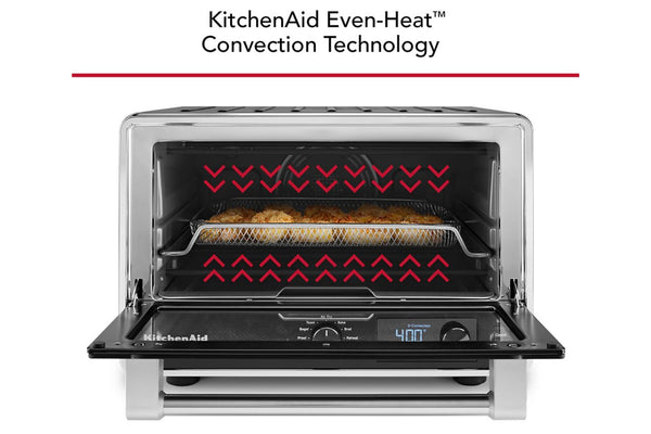 Horno de convección de sobremesa KitchenAid con puerta de cristal, mostrado con la puerta interior abierta y flechas rojas que indican el calor en la parte superior. El texto en la parte superior dice: «Tecnología de convección de calor uniforme KitchenAid».