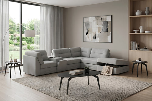 Gray fabric sectional sofa with storage ottoman, adjustable headrests, and center console in modern living room.