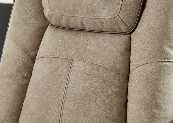 Primer plano del tapizado beige con reposacabezas.
