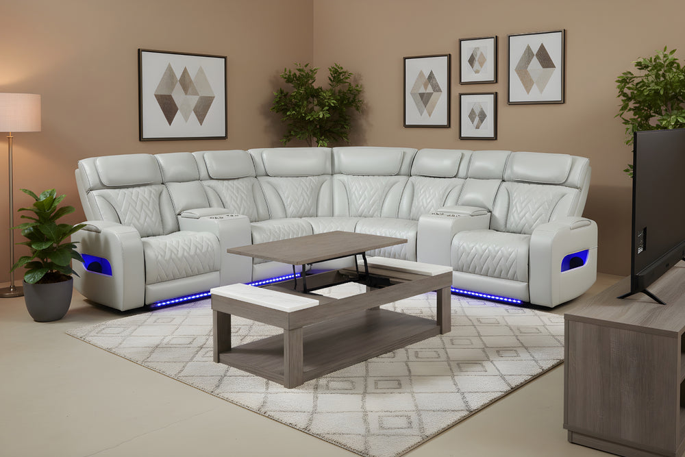 Seccional reclinable blanco con luces LED azules por debajo de los asientos sobre un fondo blanco. 