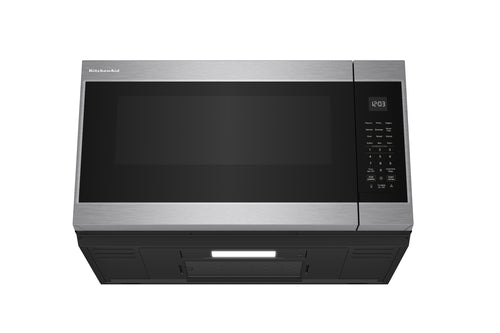 Horno microondas con extractor de acero inoxidable sobre fondo blanco