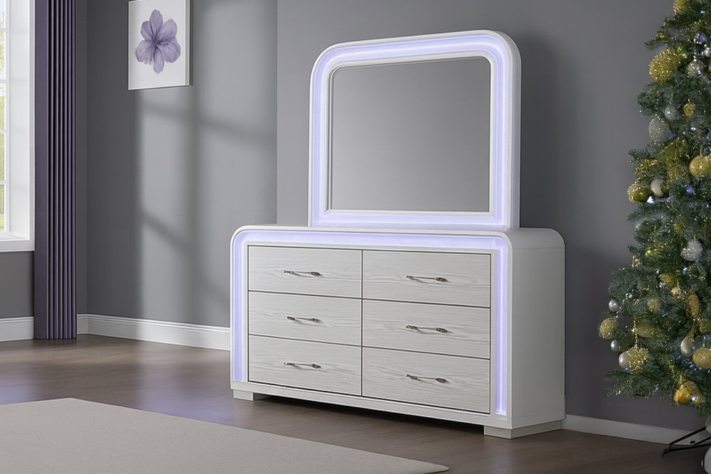 Gavetero con espejo blanco con luces LED y con seis gavetas en un entorno de habitación moderno. 