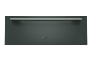 Cajón calentador KitchenAid de 30 pulgadas en color verde con acabado mate, frente liso, tirador tubular horizontal de acero inoxidable y logotipo centrado, presentado sobre fondo blanco.