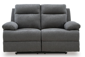 Un sofá reclinable de dos plazas en tela gris con dos cojines de asiento independientes y reposabrazos acolchados, mostrado sobre un fondo blanco liso.