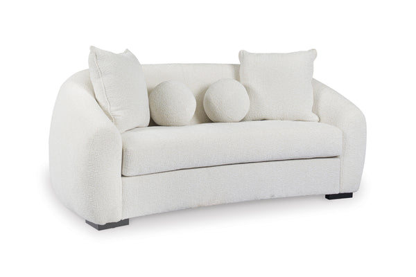 Loveseat blanco con cojines sobre fondo blanco.