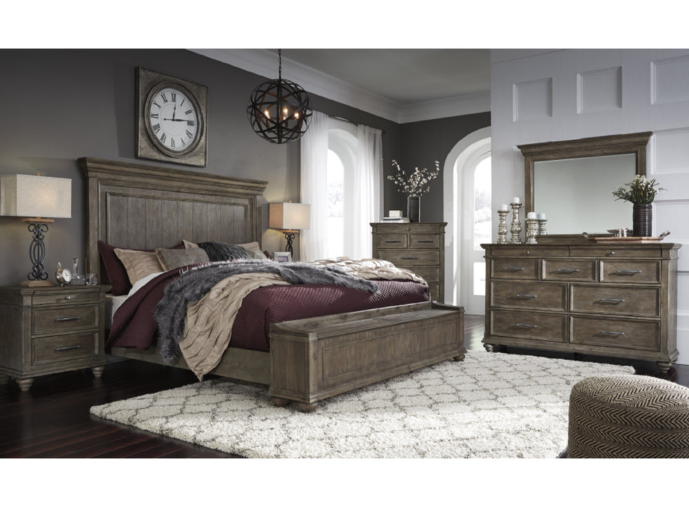 Conjunto de habitación rústico hecha de madera que incluye una cama, un gavetero con espejo, un chest y una mesa de noche en una habitación con elementos decorativos. 