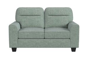 Loveseat de color verde menta sobre un fondo blanco. 