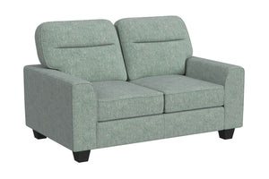 Vista lateral de loveseat de color verde menta sobre un fondo blanco. 