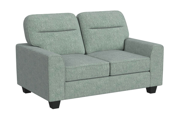 Vista lateral de loveseat de color verde menta sobre un fondo blanco. 