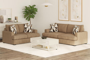 Sofá y loveseat de color marrón con cojines decorativos y con una mesa de centro en una sala moderna. 
