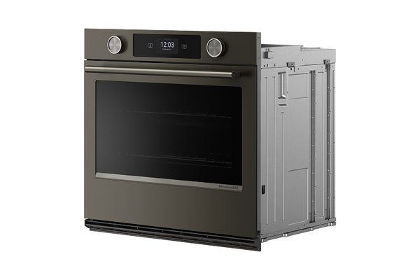 Horno empotrado visto desde un ángulo de tres cuartos, que deja ver el panel lateral y la estructura trasera. El horno tiene un acabado metálico gris oscuro, una gran ventana de cristal negro, una pantalla digital y dos mandos giratorios.