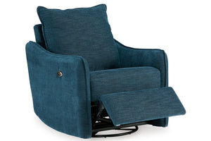 Reclinadora giratoria motorizada azul de tela texturizada estilo contemporáneo, con reposapiés extendido en sala moderna