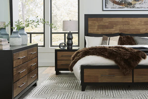 Dormitorio moderno con muebles de madera, que incluye cama y cómodas, en una habitación bien iluminada.