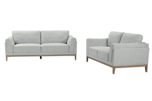 Conjunto de sofá y loveseat gris claro sobre fondo blanco
