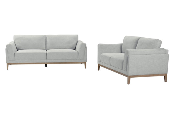 Conjunto de sofá y loveseat gris claro sobre fondo blanco