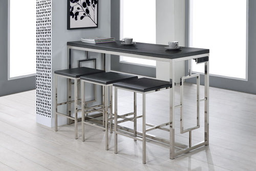 Mesa alta tipo barra con superficie negra y estructura metálica cromada, acompañada de tres taburetes a juego que se almacenan debajo de la mesa. Diseño compacto y moderno, ideal para apartamentos, cocinas pequeñas o desayunadores
