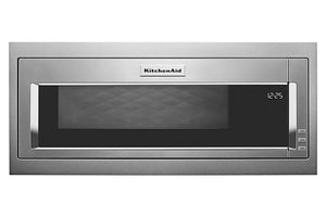 Horno microondas empotrable de acero inoxidable con puerta de cristal negro y pantalla digital que muestra las 12:25. El logotipo de KitchenAid es claramente visible en la parte superior central del aparato.