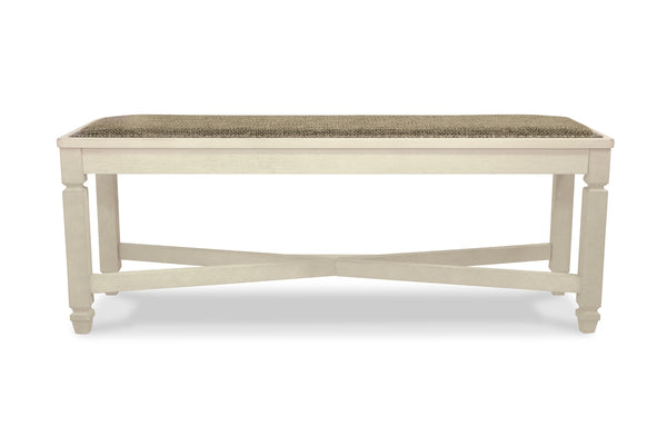 Un banco de madera natural clara con asiento tapizado en color topo texturizado, mostrado desde un ángulo de tres cuartos sobre un fondo blanco.