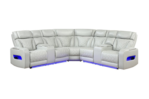 Sofá seccional reclinable color blanco o crema, con diseño curvo, respaldos acolchados, detalles capitonados, consolas con portavasos, compartimientos laterales iluminados y luces LED azules en la base sobre un fondo blanco.