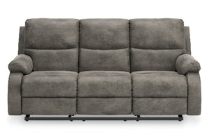 Sofá reclinable manual de tres plazas tapizado en tela gris texturizada, mostrado desde un ángulo frontal sobre un fondo blanco.