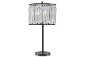 Lámpara de mesa con pantalla de cristal sobre fondo blanco.