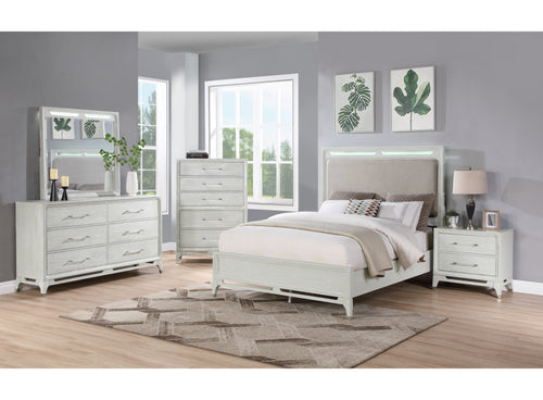 White, textured bedroom set with LED lights featuring a bed, a dresser with mirror, a nightstand and a chest in a bright room setting with windows. 