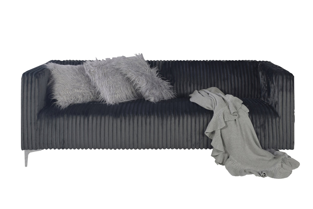 Sofá gris oscuro con estampado texturizado y una frisa gris clara sobre fondo blanco.