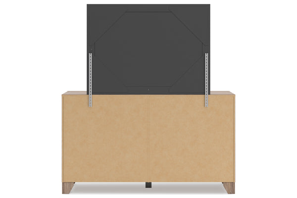 Un mueble de almacenamiento de con un panel gris carbón oscuro levantado sobre él, sobre un fondo blanco sencillo.