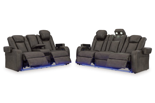 Sofá y loveseat reclinable eléctrico de color negro con luces LED sobre un fondo blanco. 