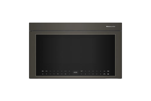 Horno microondas empotrable con acabado gris carbón oscuro, visto de frente sobre un fondo blanco liso. La marca «KitchenAid» es visible en la esquina superior derecha del marco de la puerta.