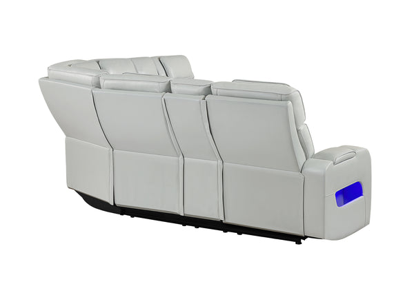 Vista posterior de seccional reclinable blanco con luces LED azules por debajo de los asientos sobre un fondo blanco. 