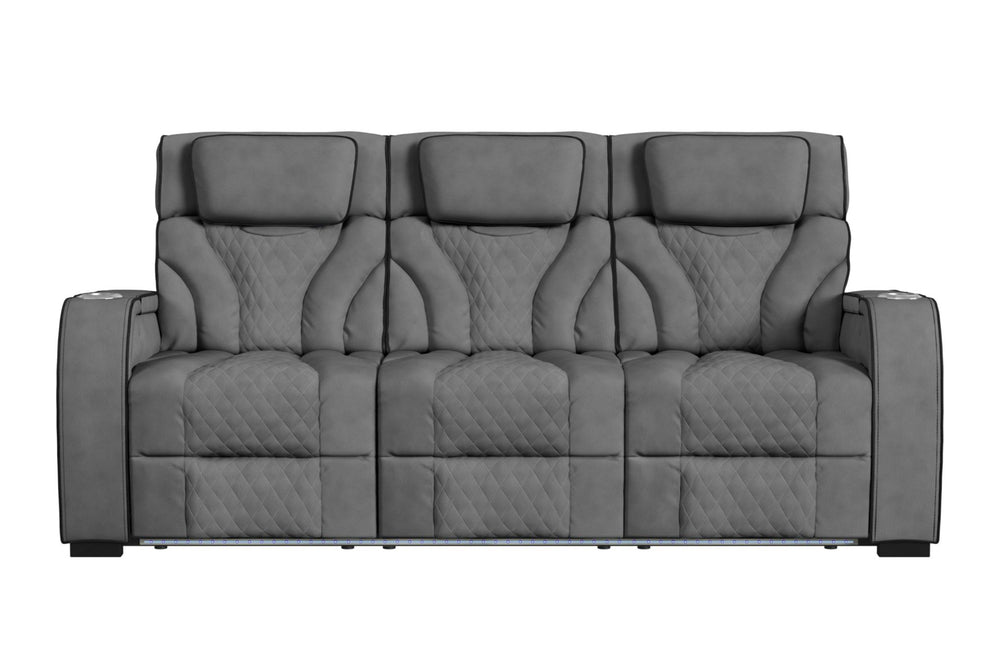 Sofá reclinable de tres plazas en color gris oscuro, con respaldo alto, cabeceras acolchadas, tapizado con patrón acolchado tipo rombos y apoyabrazos amplios. Diseño contemporáneo con iluminación LED integrada en la base frontal.
