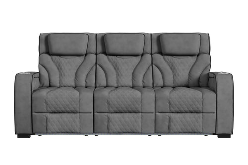 Sofá reclinable de tres plazas en color gris oscuro, con respaldo alto, cabeceras acolchadas, tapizado con patrón acolchado tipo rombos y apoyabrazos amplios. Diseño contemporáneo con iluminación LED integrada en la base frontal.