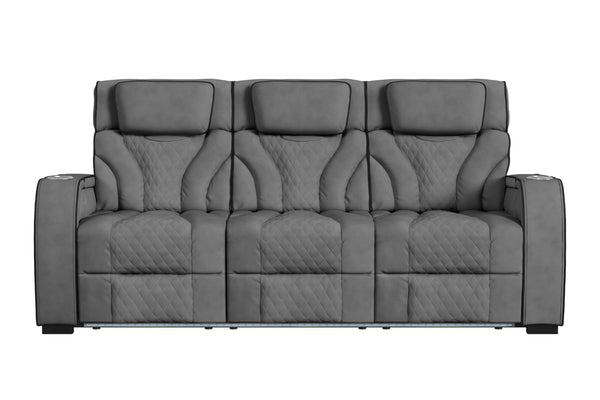 Sofá reclinable de tres plazas en color gris oscuro, con respaldo alto, cabeceras acolchadas, tapizado con patrón acolchado tipo rombos y apoyabrazos amplios. Diseño contemporáneo con iluminación LED integrada en la base frontal.