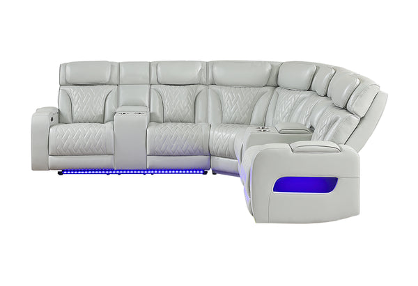 Vista lateral de seccional reclinable blanco con luces LED azules por debajo de los asientos sobre un fondo blanco. 