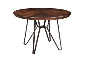Una mesa de comedor redonda de madera con superficie de grano café oscuro y base de patas metálicas tipo horquilla en color negro, sobre un fondo blanco sólido.