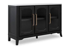 Un servidor de madera negra con superficie blanca, que cuenta con tres puertas con frente de vidrio, tiradores dorados y paneles decorativos, mostrado sobre un fondo blanco.