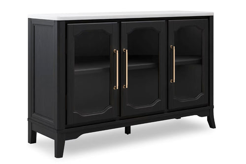Un servidor de madera negra con superficie blanca, que cuenta con tres puertas con frente de vidrio, tiradores dorados y paneles decorativos, mostrado sobre un fondo blanco.