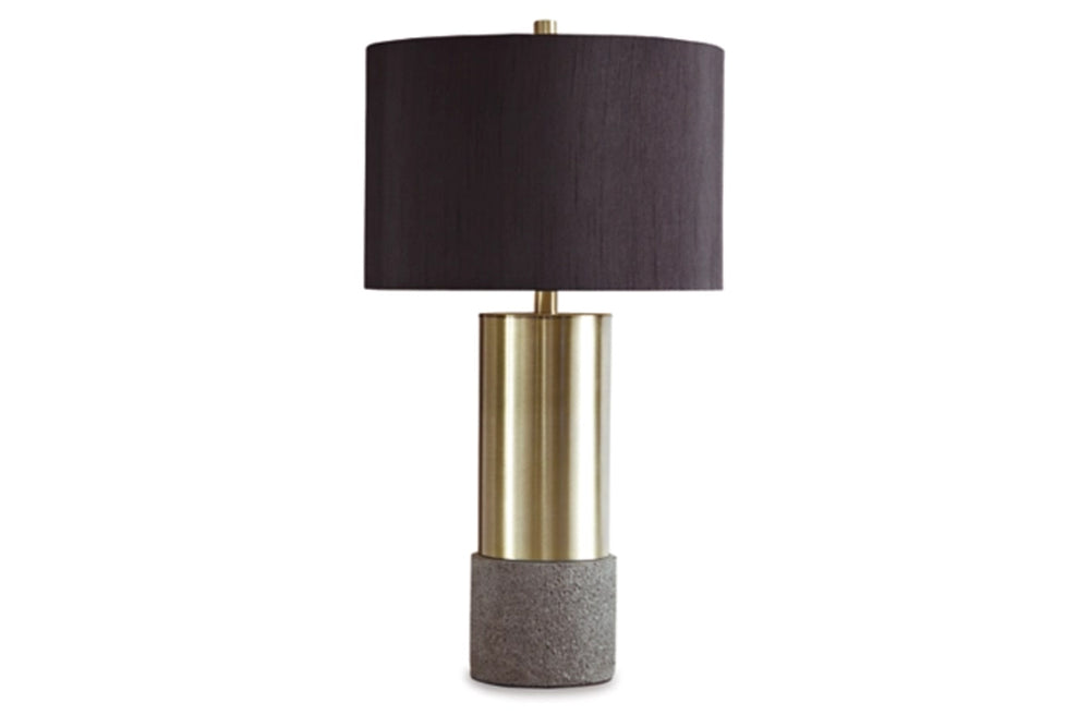 Lámpara de mesa con pantalla negra, sección central dorada y base gris sobre fondo blanco.